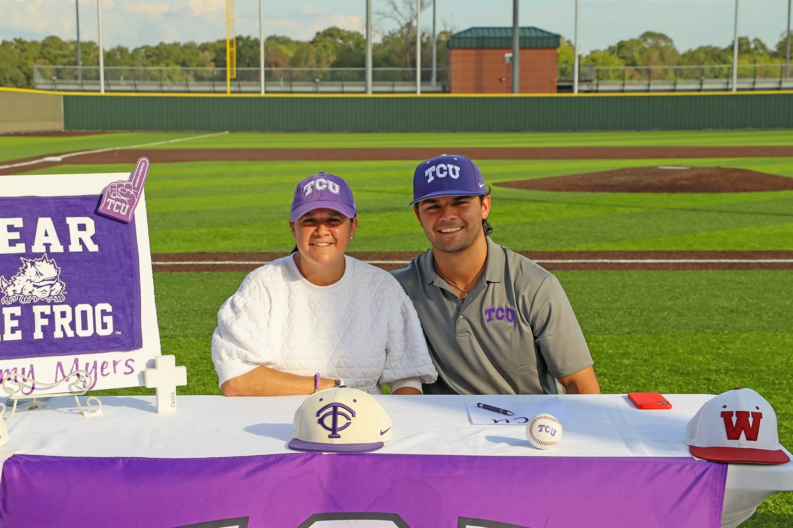 Cypress Woods High School senior Sam Myers, right, signed a letter of intent to play baseball at Texas Christian University. 